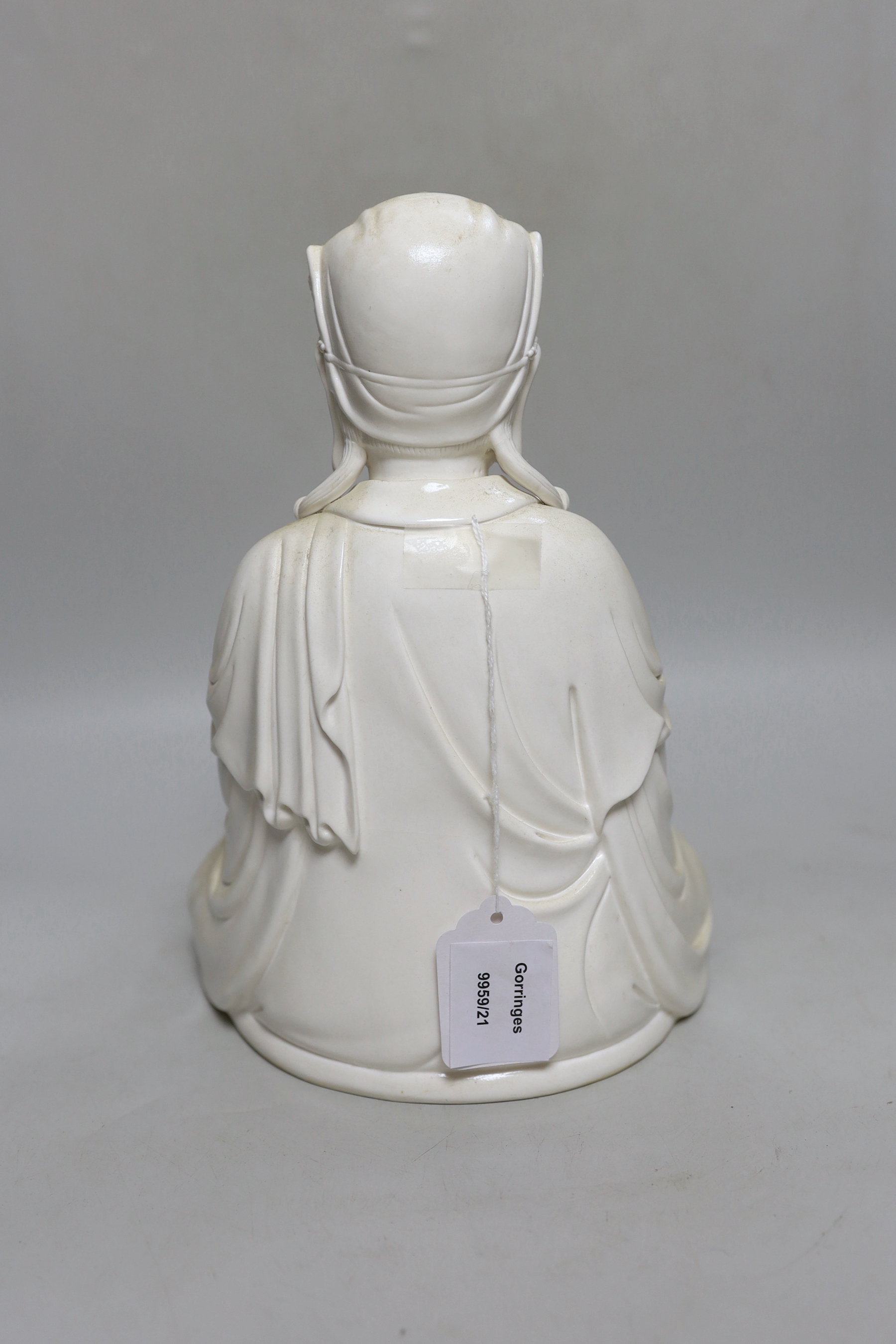 A Chinese blanc de chine seated figure of Guanyin, 29cm high